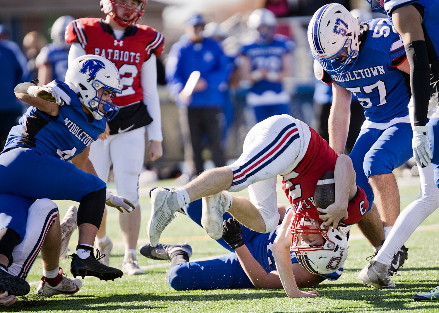 Jack Voute takes a tumble while running through the Middletown defense.