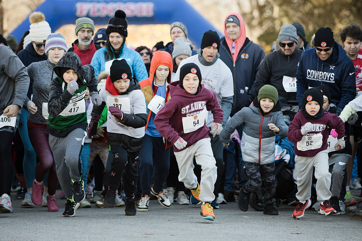 Lachlan Donaghy (middle) leads the way as he and other participants take off at the start of the 1.5-mile race. More than 200 people participated in the 24th annual Trot Off Your Turkey 1.5-mile race.