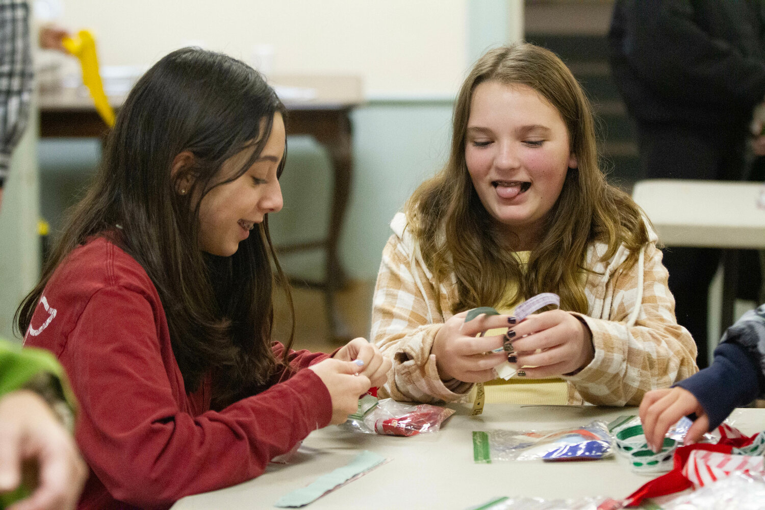 Alaina Contente, 13, (left) and Layla Mizener, 13, make ornaments at the First Methodist Church.