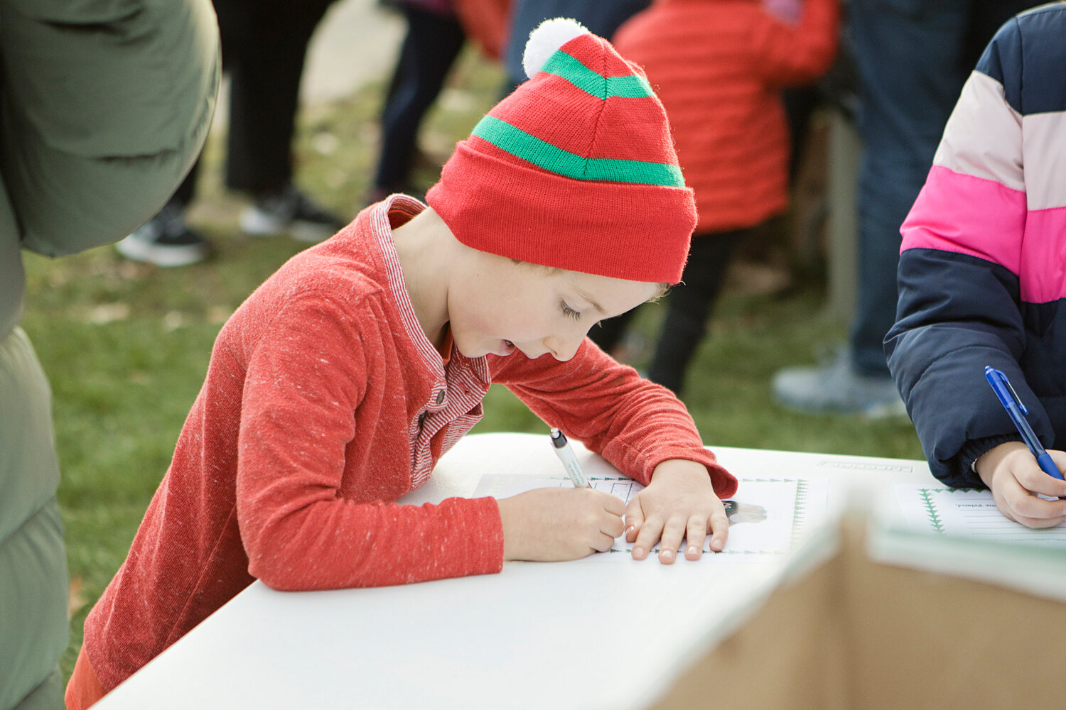 Charlie Vestal writes a letter to Santa during the town’s annual tree-lighting event on Saturday, Dec. 2.