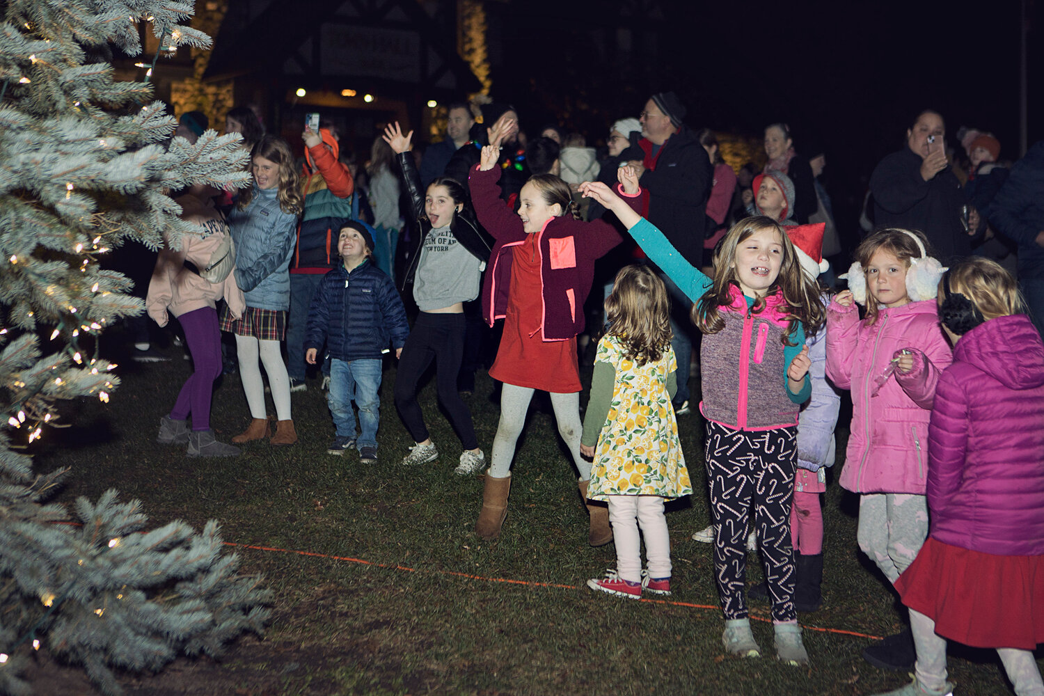 The crowd cheers as Barrington's tree is lit, Saturday night.