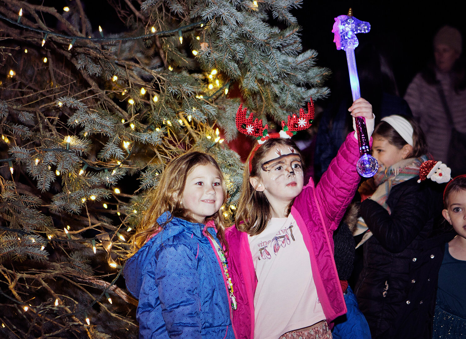 Madeline Miller (left) and Larkin Damell pose for a photo after the tree is lit.
