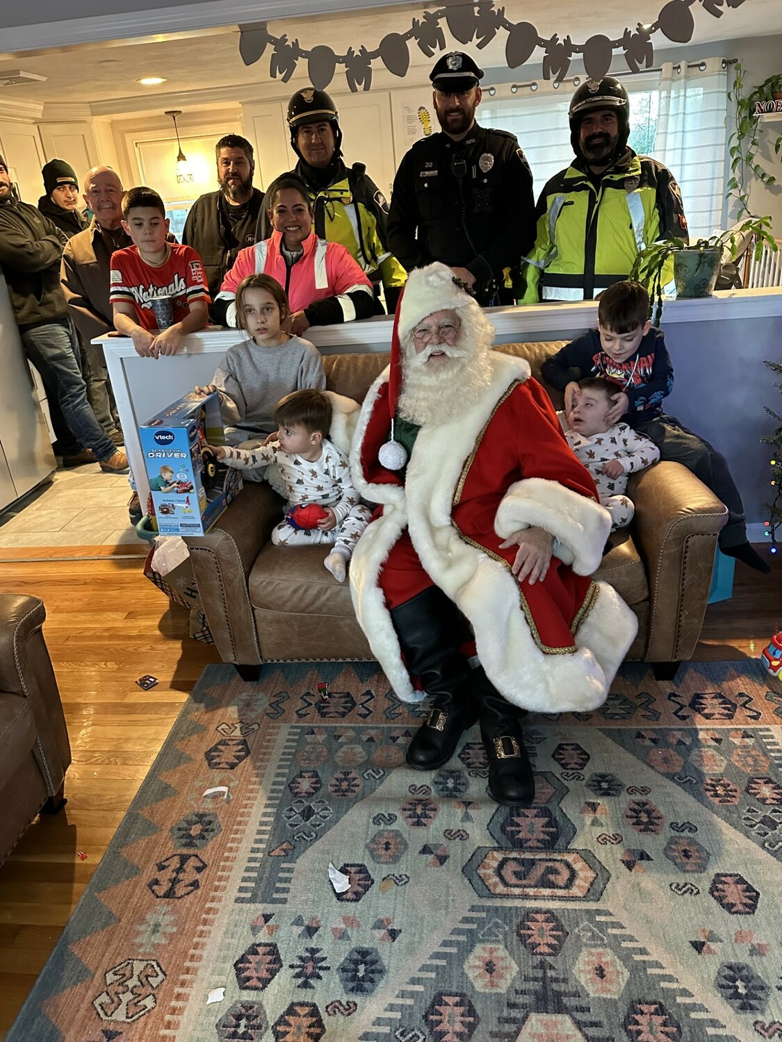 Harper, Nico and Cash Correia visit with Santa at their home.