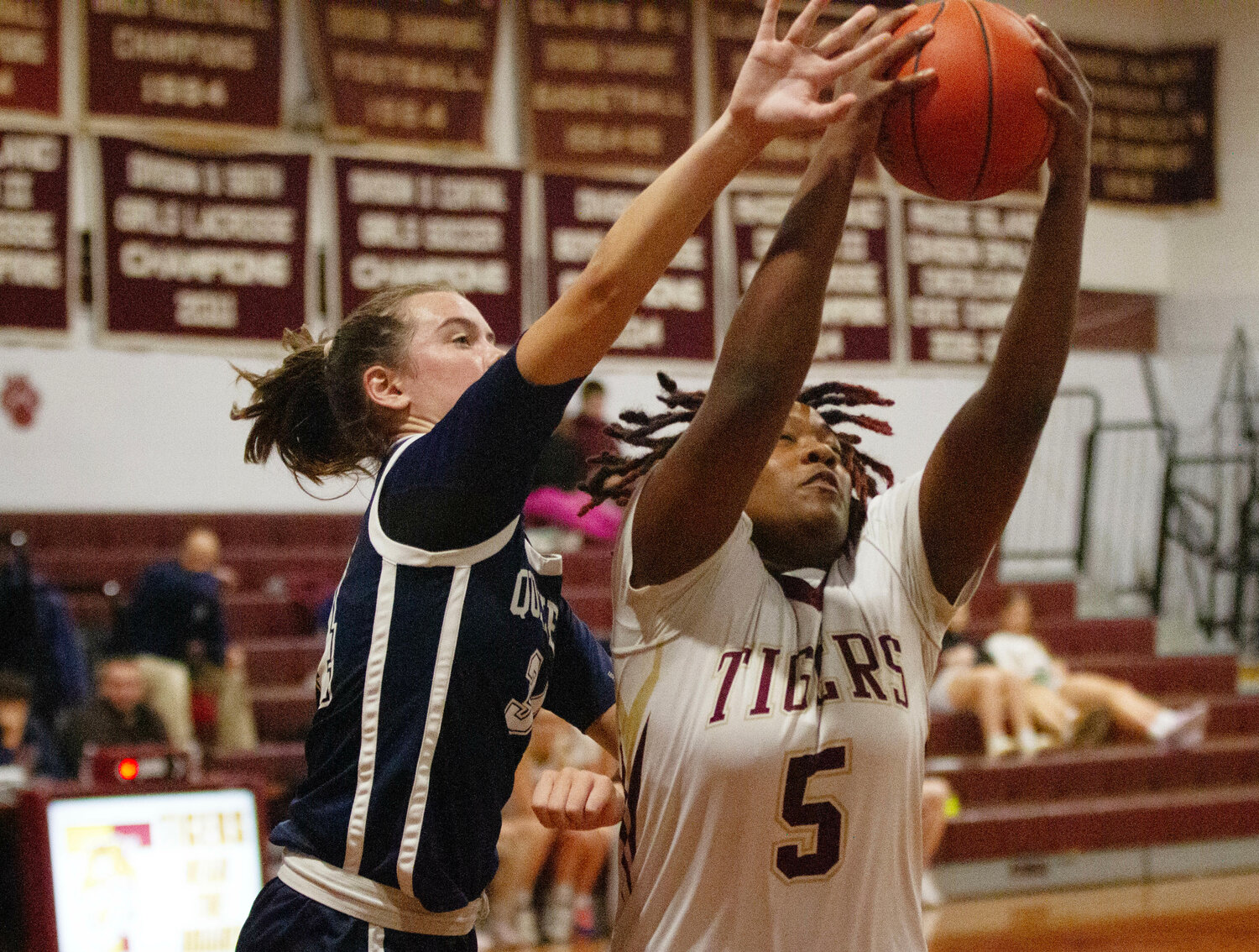 Jah'niece Branch pulls down a rebound in the first half of the Tiger's loss to Moses Brown on Thursday night. Branch led the team in scoring with 12 points.