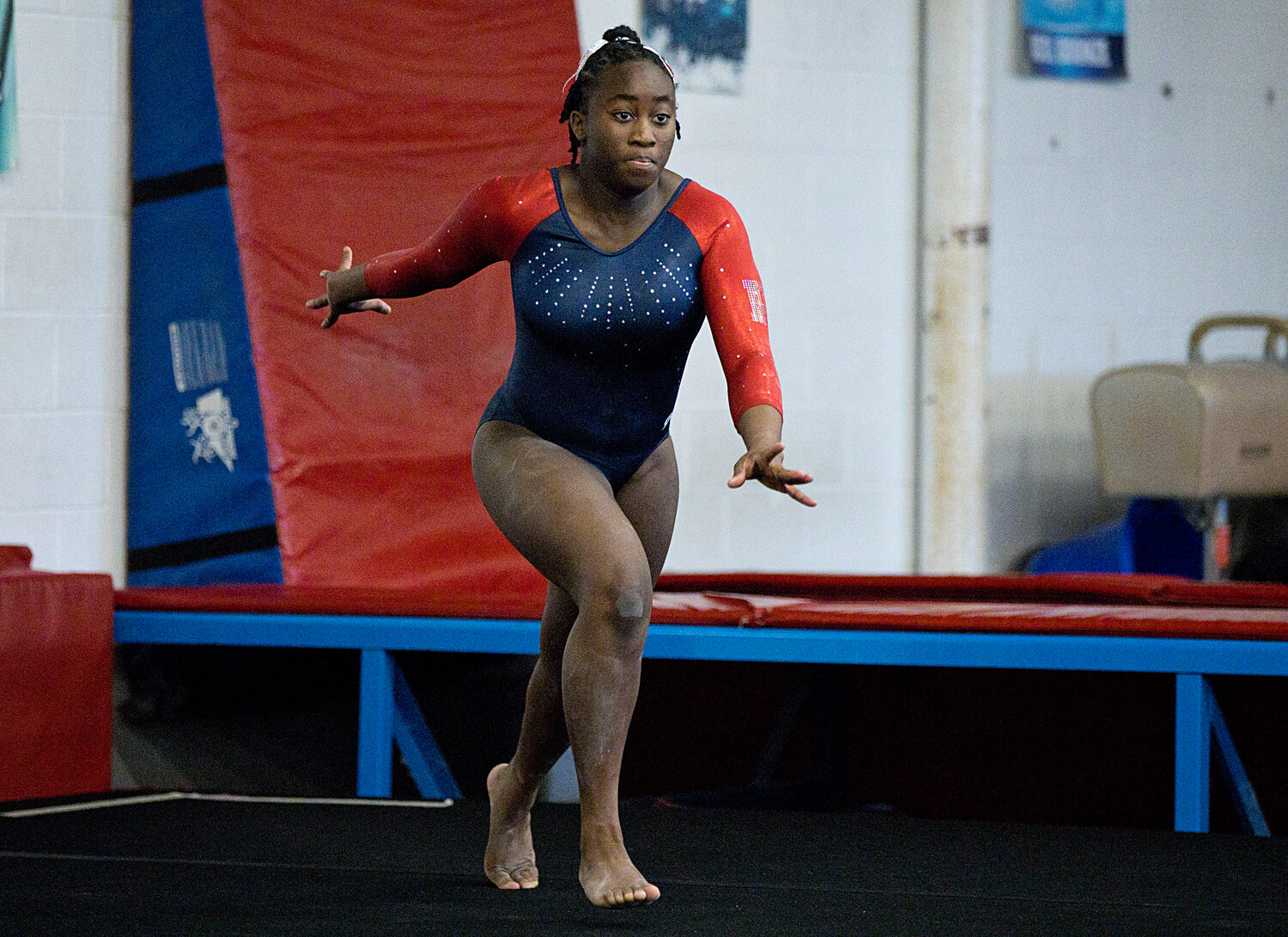 Roshana Webster completes a tumbling pass while performing her floor routine.