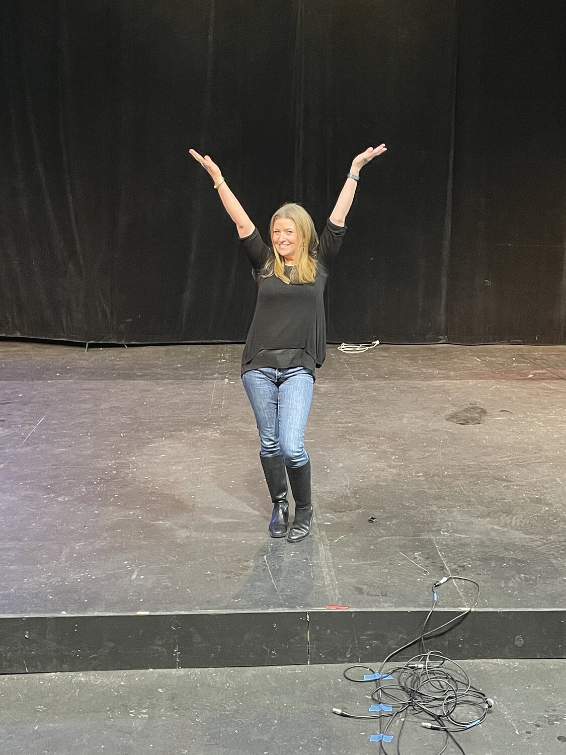Dena Davis shows off the newly constructed stage, which will soon be hosting auditions, then rehearsals and performances, for “Chicago: Teen Edition.”