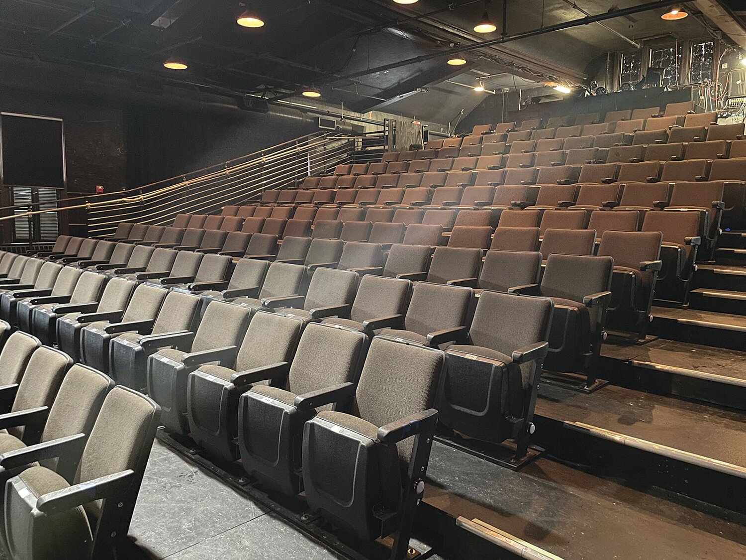 Many volunteers from multiple organizations worked with the property owner to re-construct the entire theater space. Left “in the round” by former owners, the stage, risers and seats were all removed, rebuilt and re-installed in a more traditional theater format.