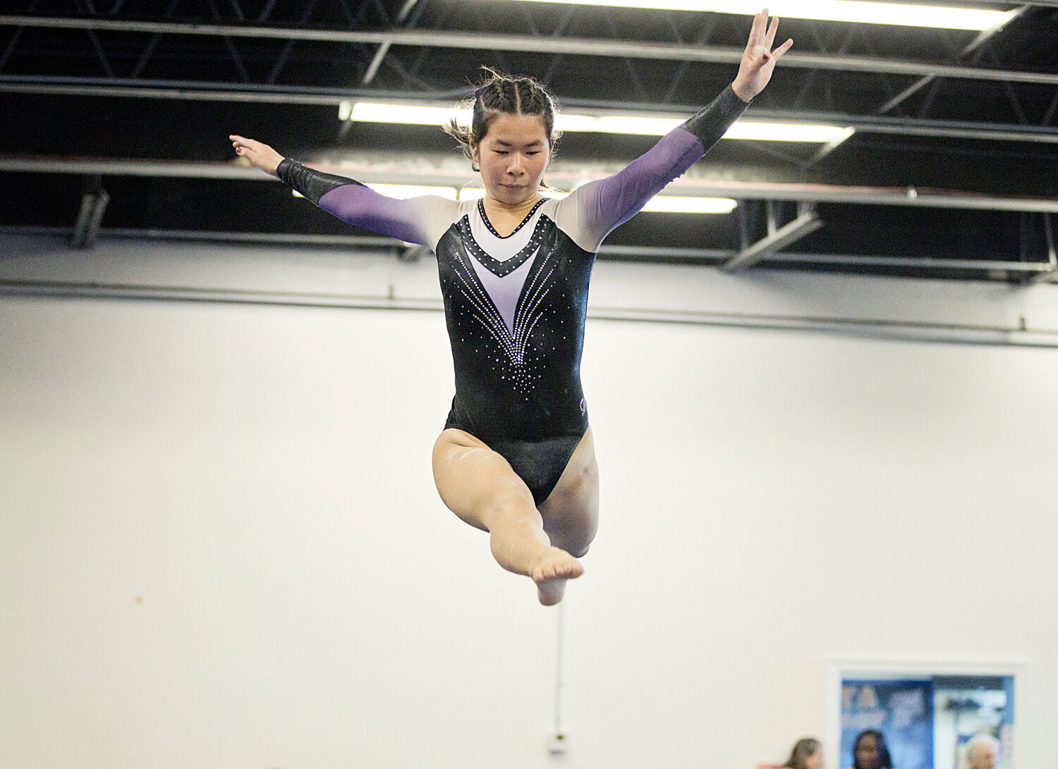 Caroline Nash performs her beam routine, earning a team high of 9.0 on the event. 