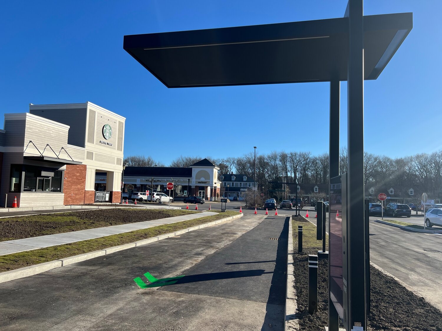 What will the drive-through lane at the new Starbucks mean to the Barrington Shopping Center?