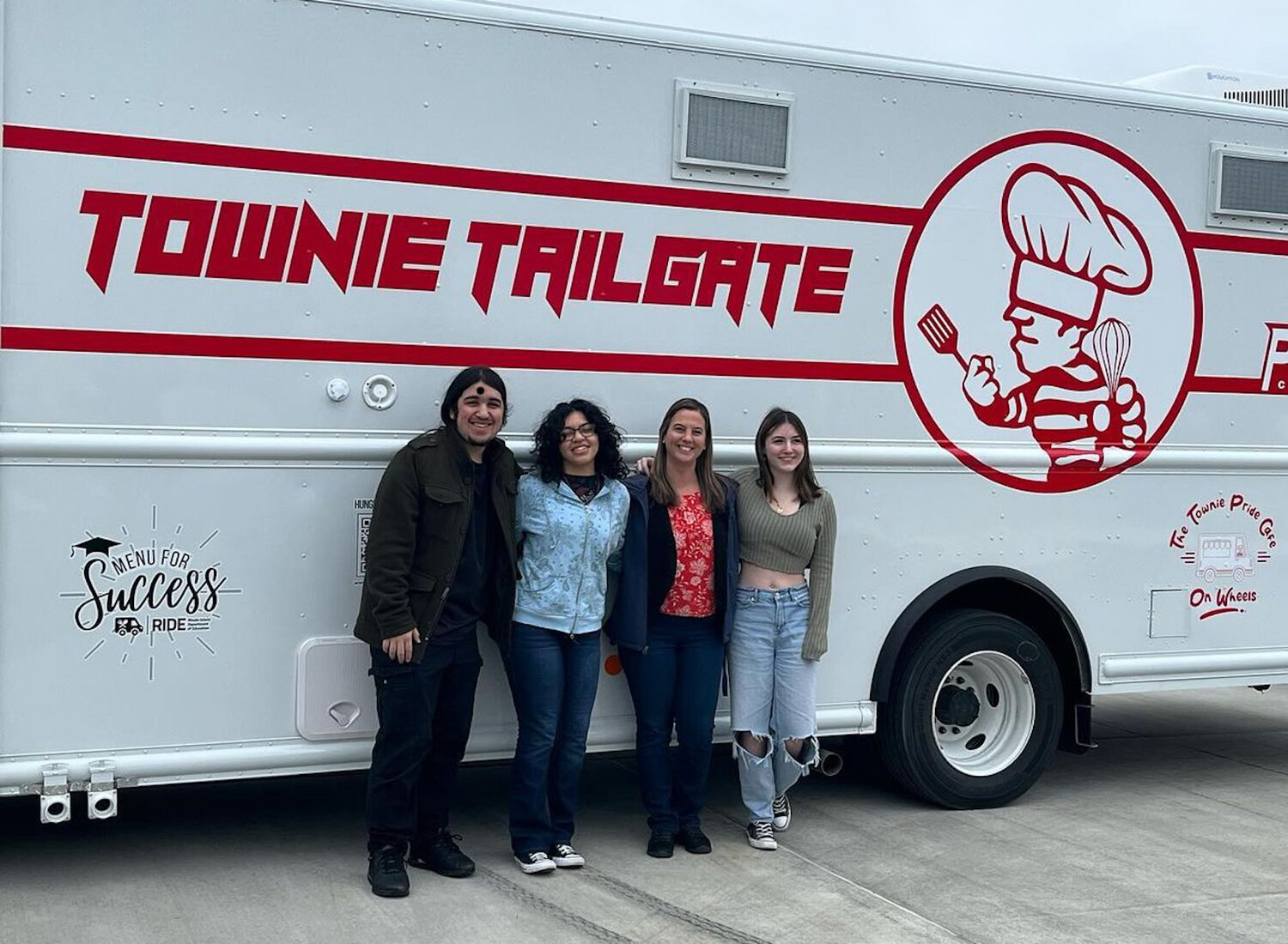 CTC Graphic Department students in the class of instructor Delia Nelson (center) created the truck wrap featuring EPHS mascot "Joe Townie."