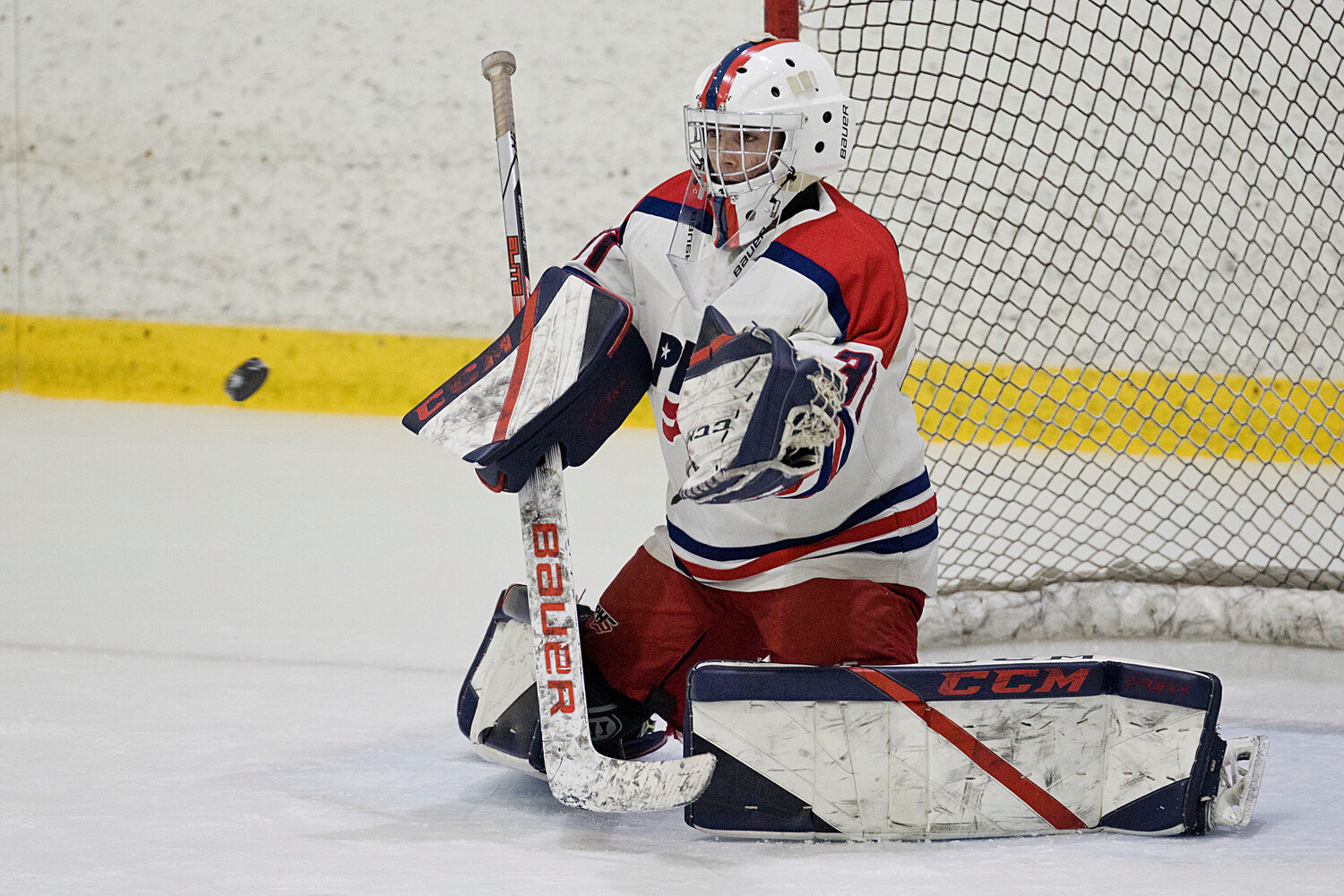 Patriots’ goalie Jonathan Cabral makes a glove save while battling the Rebels.