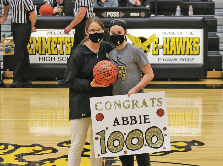 1,000 POINTS -- Abbie Schany, pictured with Lady E-Hawk Head Coach Anny Fiene, earned her 1,000th career point Friday night during Emmetsburg&rsquo;s 49-24 win over the West Bend-Mallard Wolverines. Schany, a senior at Emmetsburg High School, put 18 points on the scoreboard during Friday&rsquo;s home contest amidst cheers from family and friends.
