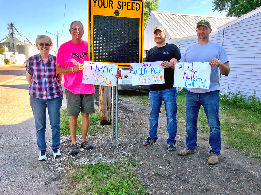 WATCH YOUR SPEED! -- The City of Cylinder installed a permanent slow down sign on Highway 18 over the summer to help curb dangerous, excessive speeding. The sign was purchased with funds from a Palo Alto Gaming &amp; Development/Wild Rose Casino mini grant. Pictured (from left), City Clerk Kathy Heng, Mayor Harry Bormann, and Councilmen Kurt Bonnstetter &amp; Cary Anderson express their gratitude for the new sign. 		    -- submitted photo