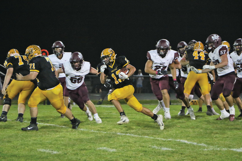 CADE SHIRK picked up 28 yards on the ground and 48 through the air Friday night. The E-Hawks totaled 211 yards of offense against the Wolfpack.  	    -- Joseph Schany photo