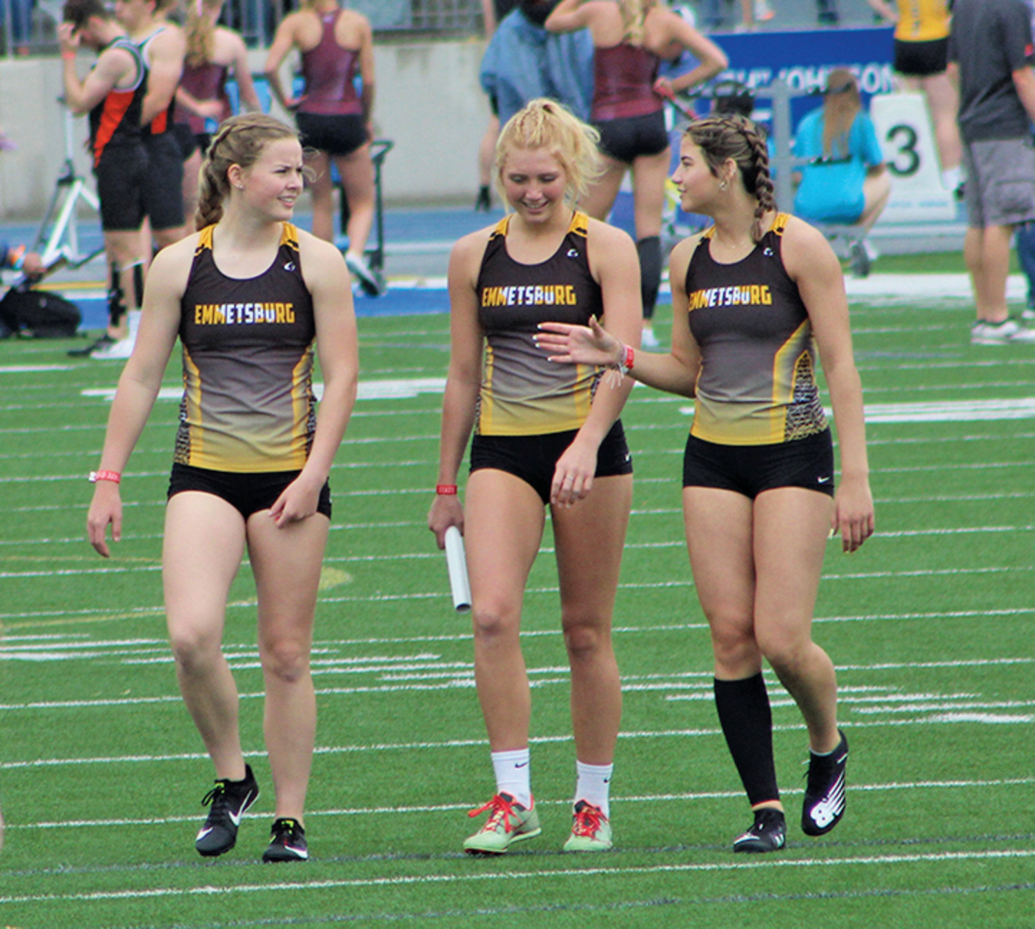 2021 STATE TRACK -- The 2021 State Track & Field Championships were held Thursday through Saturday at Drake Stadium in Des Moines. Area schools would send multiple events to the Blue Oval, with Emmetsburg earning nine bids. Above (from left), Abbie Schany, Taylor Steinkamp, and Delaney Joyce in Des Moines. Results coming Thursday.