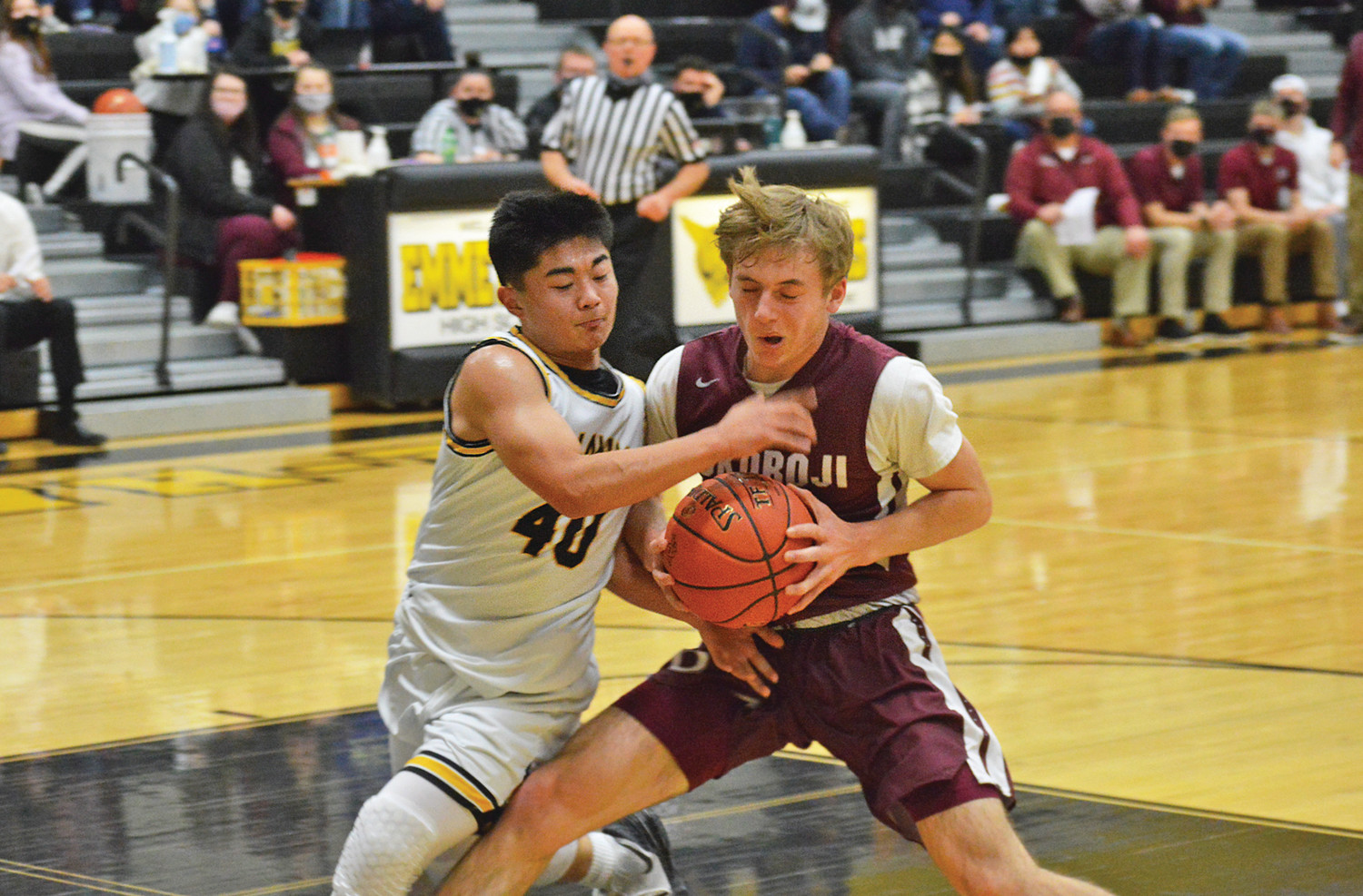 SEAN EUROPA puts the pressure on Okoboji Thursday night. Emmetsburg would struggle against the Pioneer offense to face a 74-48 defeat.             -- Joseph Schany photo
