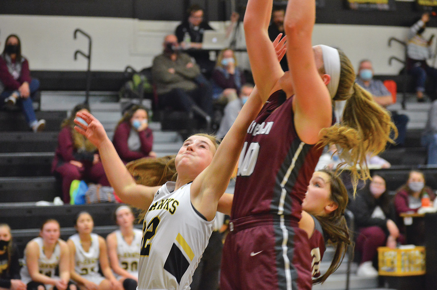 EMMA AUTEN jumps for the rebound against Okoboji Thursday night at Emmetsburg High School. The Lady E-Hawks would start strong but come up short to finish 36-45.