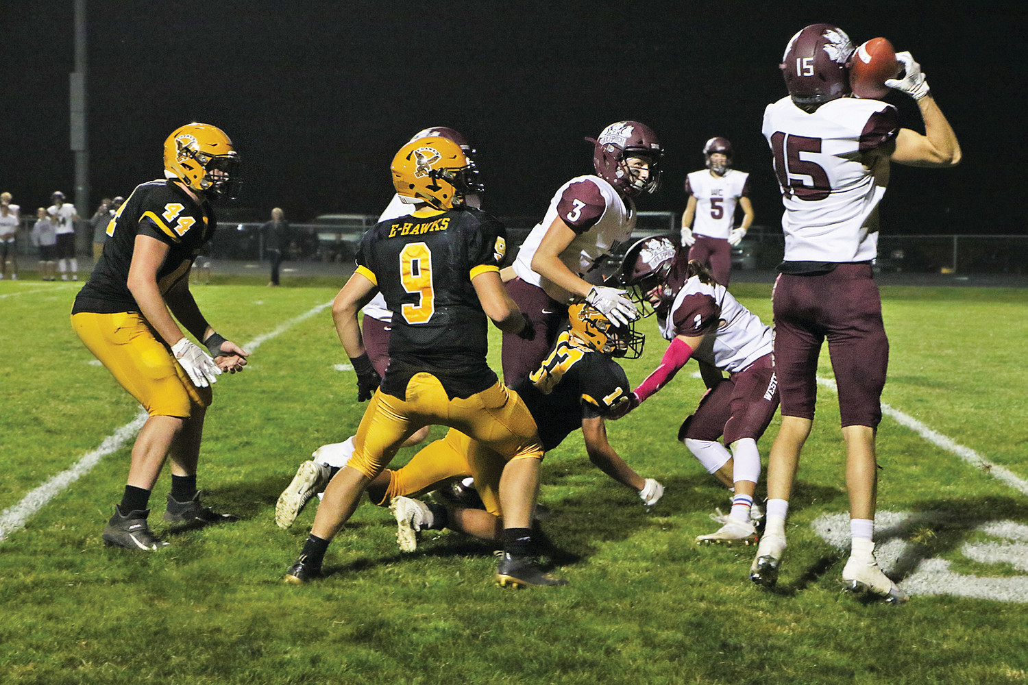 OH SO CLOSE -- With seconds left on the clock and behind by three points, Emmetsburg’s Ben Dunlap would find Cade Shirk at the 5-yard line for a 26-yard pass on 4th & 20. Unfortunately, Western Christian would force the ball loose to take possession and the 10-7 win. Pictured (from left) Matt Wirtz, Lex Kassel, and Shirk helplessly watch as the ball comes to rest in Wolfpack arms. The loss is Emmetsburg’s first this season.		       -- Joseph Schany photo