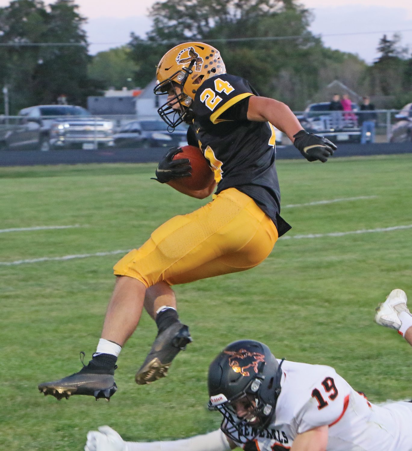 Seth Freeman leaps into the end zone during Emmetsburg's 63-21 Homecoming win over Sibley-Ocheyedan.