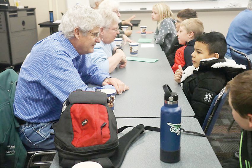 Ed and Joan Nims, longtime RSVP volunteers, met with their Demoney Elementary pen pals from Jennifer Gesche&rsquo;s fourth-grade class.  Photo by Michael Tidemann