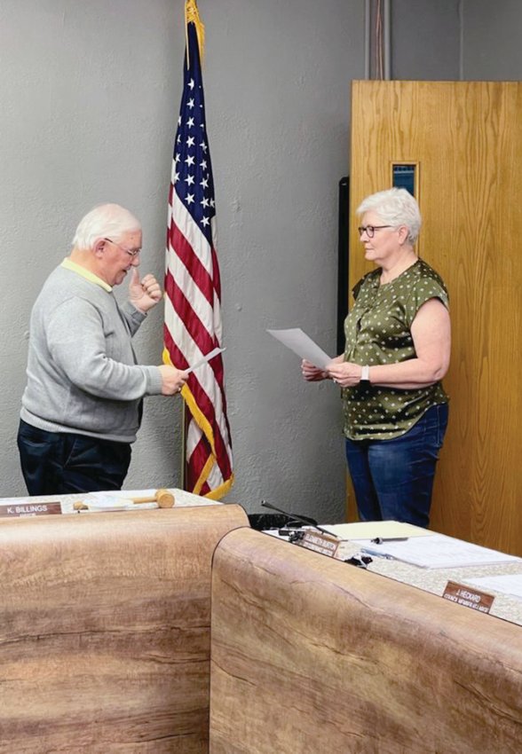 City clerk Beth Burton delivers the oath of office to Kenny Billings for a two-year term as mayor of Estherville. Billings previously told the Estherville News he is willing to serve the community once again for two years until the next mayoral election.