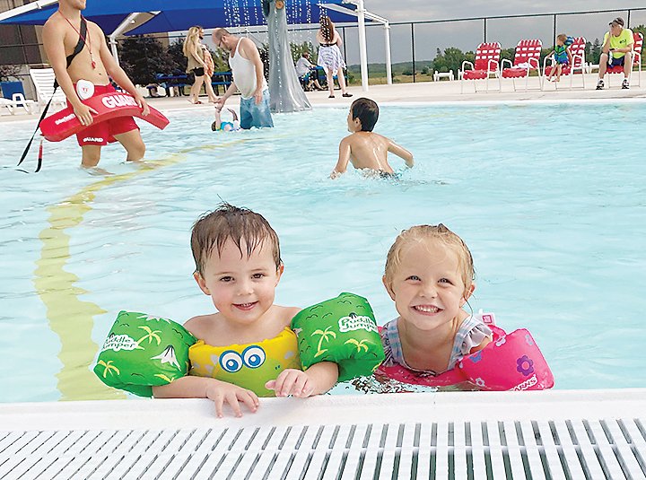 Aiden Howing and Evelyn Smith enjoy their time at the Estherville Aquatic Center.  Photo submitted