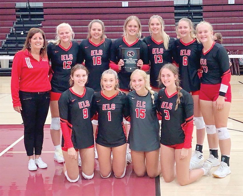 The Estherville Lincoln Central Volleyball Team poses with its tournament trophy after winning at Okoboji High School in Milford on Tuesday, Aug. 30. Front from left are Audree Reinhardt, Kiera Dalen, Mara White, Taylor Kloucek; back row: Coach Jean Jensen, Jersie Nitchals, Emily Regelstad, Piper Quastad, Haley Nissen, Josie Danner and Hillary Ruschy.