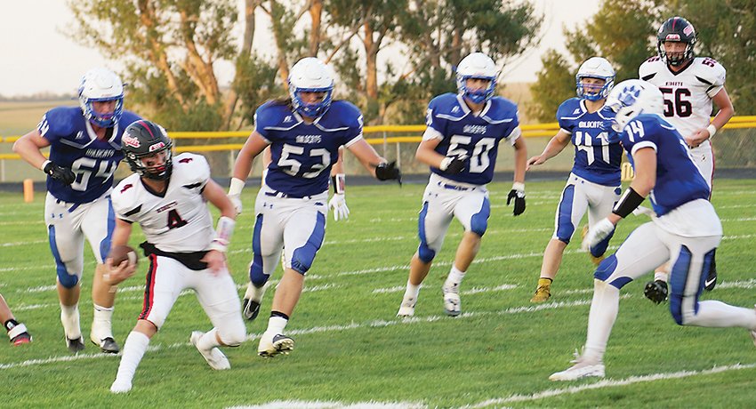 ELC quarterback Owen Larson (4) is surrounded by West Lyon defenders during last Friday&rsquo;s loss to the Wildcats. ELC will look to rebound this week as Humboldt comes to Estherville.  Photo by David Swartz