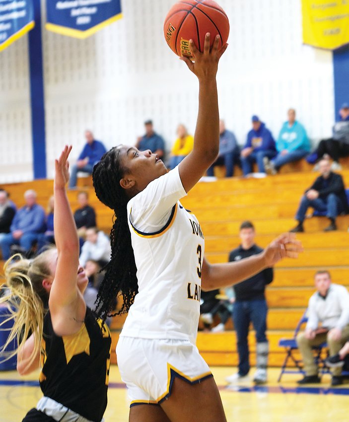 Makayla Holton goes in for the layup against the Dordt JV on Monday.  Photo by David Swartz