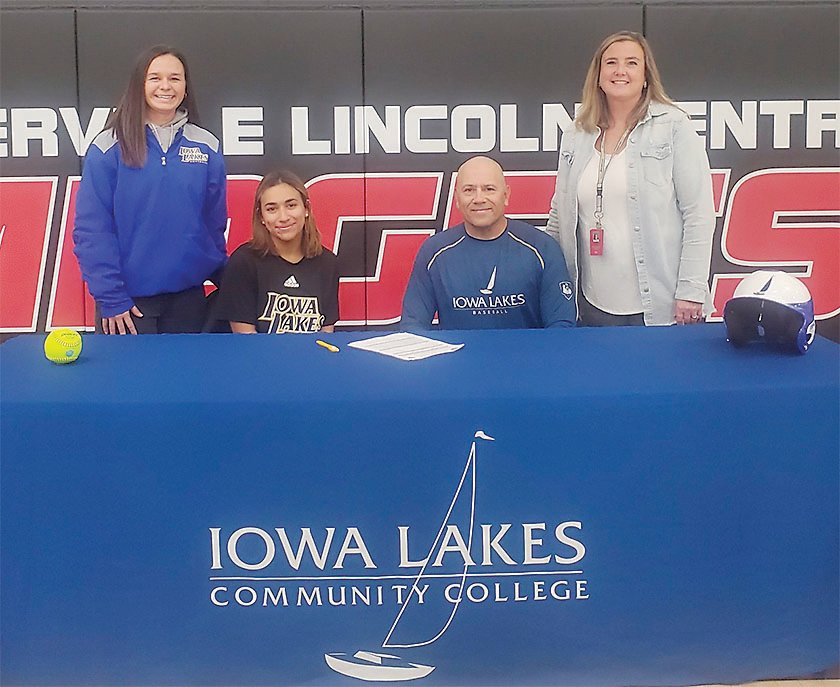 Darieliz Acosta signs her letter of intent to play softball for Iowa Lakes. Pictured from left are Iowa Lakes Head Softball Coach Katie King, Darieliz Acosta, Daniel Acosta, and Estherville Lincoln Central Head Softball Coach Megan Anderson.  Photo submitted