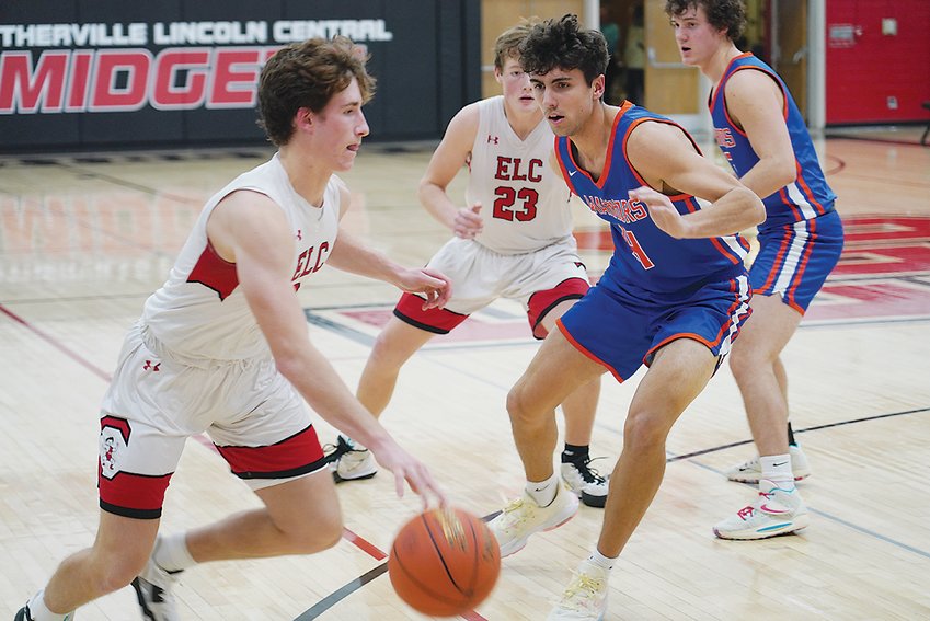 ELC&rsquo;s Owen Larson opened the season with a 41-point effort against Algona on Monday. However, the Bulldogs won with a balanced attack. Larson is just the third player in school history to score at least 40 points in a game. Eric Willey holds the school record with a 48-point effort. Justin Heinrichs scored 40 points in a game during his career. Above, Larson drives to the basket in the Achieve Scrimmage held on Nov. 18 against Sioux Center.  Photo by David Swartz
