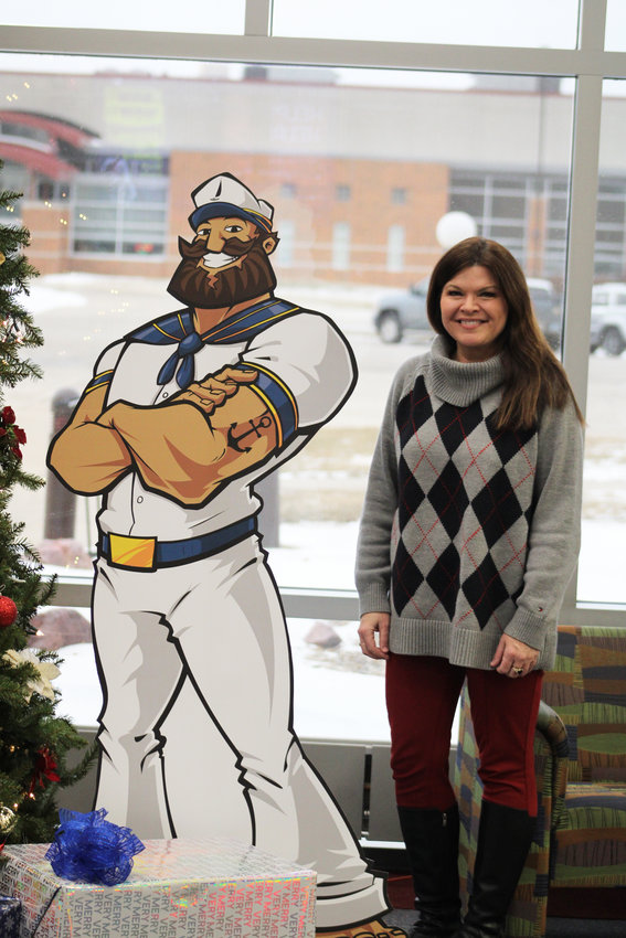 Erin Latona, dean of the Estherville campus of Iowa Lakes Community College, takes a break next to Captain Jack, the college mascot, during finals week.     Photo by Amy H. Peterson
