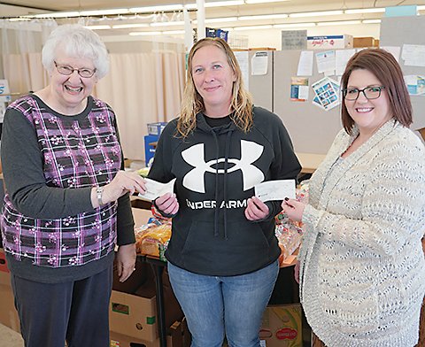 The Estherville WA TAN YE Club donated money from its Christmas party to UDMO. From left to right are  Grace Spalding, WA TAN YE Club treasurer; Ashley Cooklin, UDMO; and Pamala Mittrucker, WA TAN YE Club president.  Photo by David Swartz