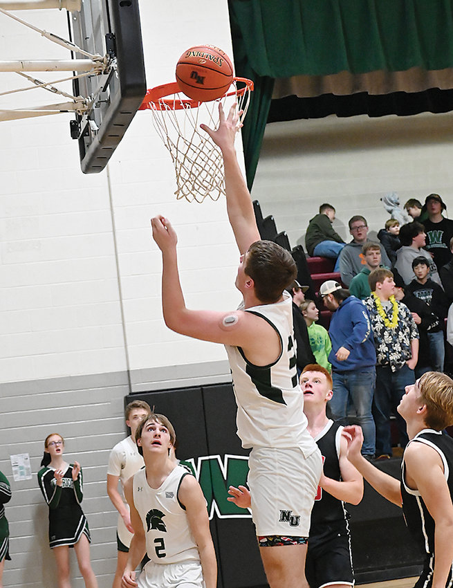 North Union&rsquo;s Kody Irmiter goes up for two of his game-high 16 points last Friday in Armstrong.  Photo by Kim Meyer, Bancroft Register