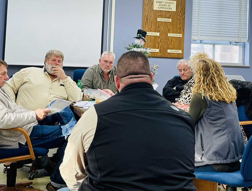 Supervisors, from left: John Pluth, Jeff Quastad, chair Todd Glasnapp, Tim Schumacher, and Lisa Hansen, listen as project manager Kylie Kretz and construction manager Richard Dove provide an update on the Summit Carbon Solutions pipeline project.  Photo by Amy H. Peterson