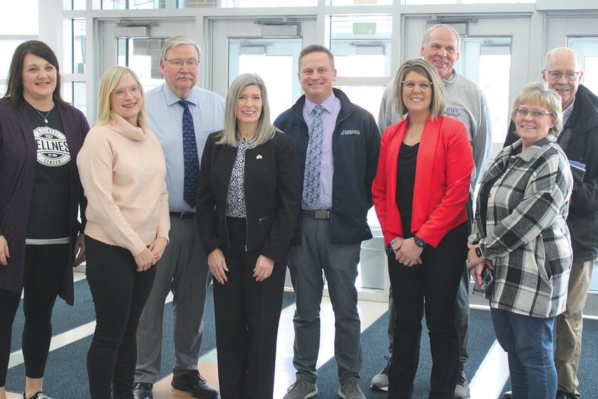 Senator Joni Ernst, center, takes a moment with leaders in Estherville and Emmet County&rsquo;s education and business sectors. From left, Jennifer Hough, co-director of the RWC;  Sandy Fandel and Tony Condon, ELC School Board members; Senator Ernst, Jeff Soper, CFO of Iowa Lakes Community College; Tara Paul, ELC Superintendent; Bob Grems, retired director of the RWC; Kay Woods, ELC Board Secretary; and Lyle Hevern. Estherville and Emmet County Economic Director.   Photos by Amy H. Peterson