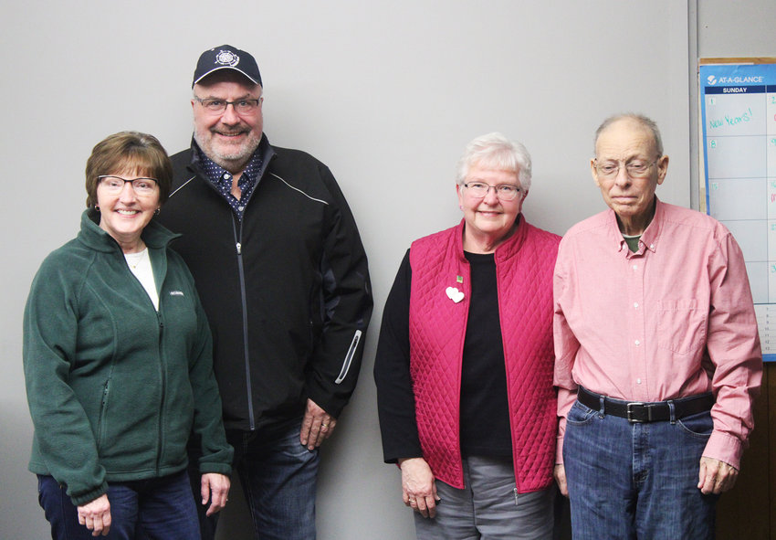 Kris Whitmer, left, and Mark Larsen, right, are two heart transplant recipients in Emmet County who spoke about the impact their transplants had on them and the newest chapters of their lives. Second from left is Kris&rsquo; husband, Kevin Whitmer; second from right is Anita Larsen, Mark&rsquo;s wife.