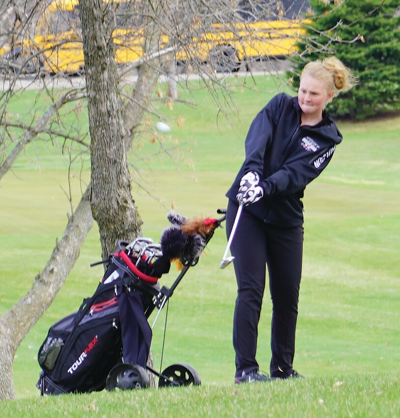 ELC&rsquo;s Emily Paulson chips onto the green on Hole No. 3 at the Estherville Golf Course.
