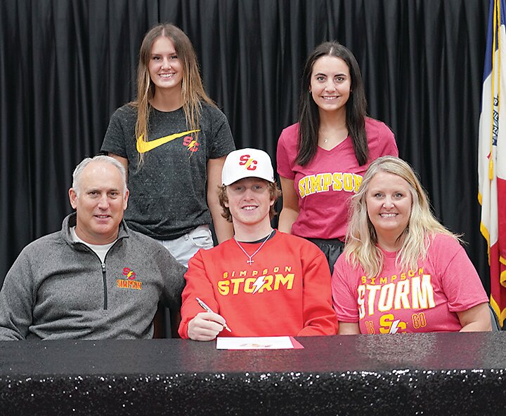 Blake Evans, front center, signed a letter of intent to play to play baseball at Simpson College this fall. Witnessing the signing are Estherville Lincoln Central head coach and Blake&rsquo;s dad, Lee Evans, mom Kieja Evans, and sisters Kendall Evans and Brenna Evans.