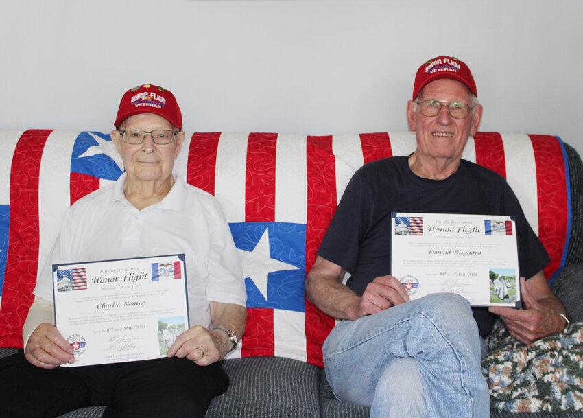 Chuck Nourse, 93, and Don Bisgaard, 89, of Estherville recently returned from the Brushy Creek Honor Flight. The two were among eight veterans from Emmet County who traveled last month to Washington, DC as part of the flight. Here, they hold their certificates honoring them for their service and participation in the flight during a talk with the Estherville News at Bisgaard&rsquo;s home. The Estherville News would be honored to interview the other six veterans from this year&rsquo;s honor flight as well as any others from recent years we haven&rsquo;t been able to interview yet, or veteran&rsquo;s stories in general. Contact the Estherville News at 712-362-2622 or apeterson@esthervillenews.net.
