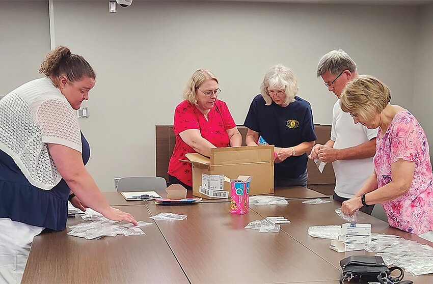 North Star Nights Kiwanians packaged band-aids for a children&rsquo;s service project.