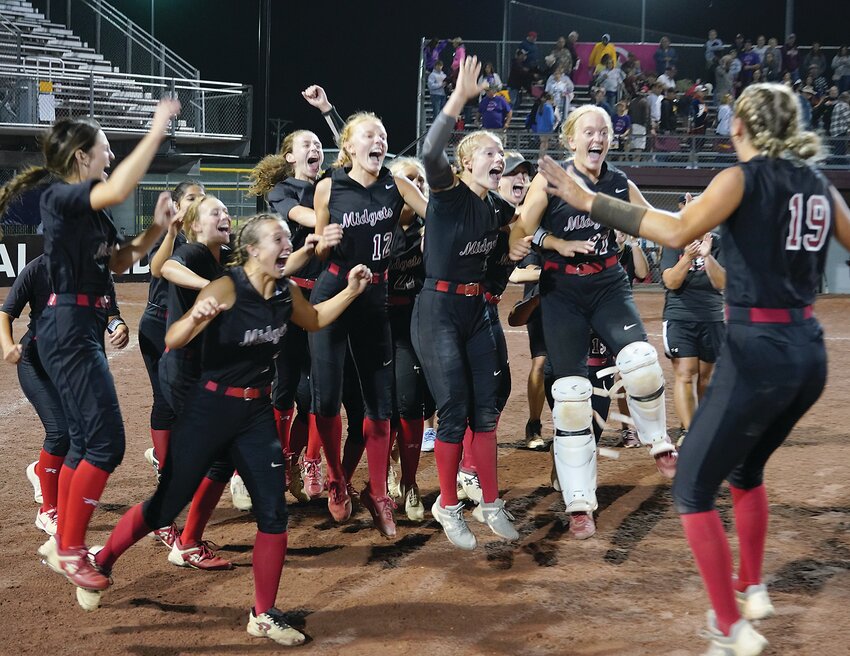 The Estherville Lincoln Central Softball Team celebrates its 11-3 win over Davis County in a Class 3A State Quarterfinal game on Monday at Harlan Rogers Sport Complex in Fort Dodge.