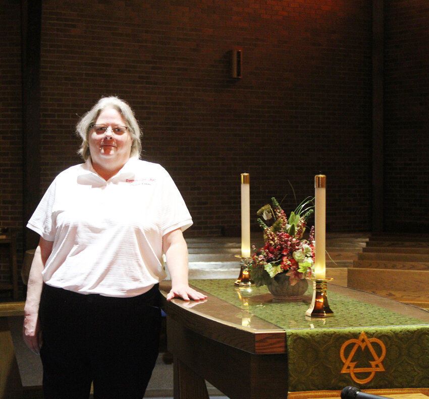 Pastor Kathy Kluis reflects on her new mission at Estherville United Methodist Church in the church sanctuary.