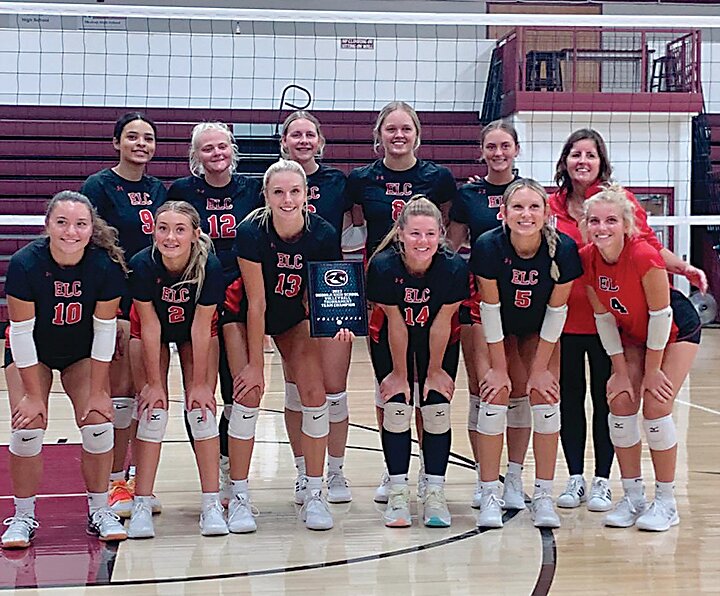 The Estherville Lincoln Central Volleyball Team poses with the 2023 Okoboji Tournament trophy. Front from left are Evi Nath, Kiera Dalen, Haley Ninssen, Kennedy Paul, Kali Thiel, Mara White; back row: Saharia White, Jersie Nitchals, Josie Danner, Piper Quastad, Taylor Kloucek and Coach Jean Jensen.