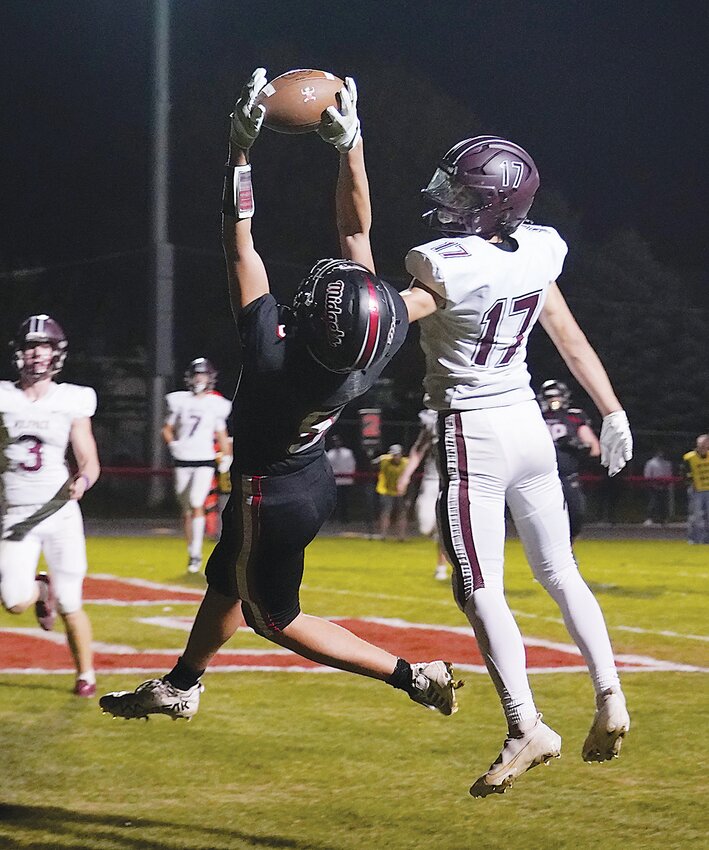 ELC senior Cael Miller (5) makes this grab for a touchdown, the Midgets&rsquo; final of the season, in Friday&rsquo;s playoff game against Western Christian.