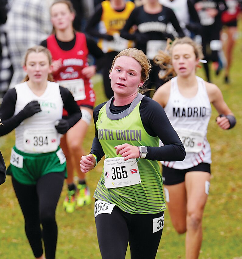 North Union junior Jacey Welbig fights for position in last Friday&rsquo;s Class 1A Girls State Meet race.