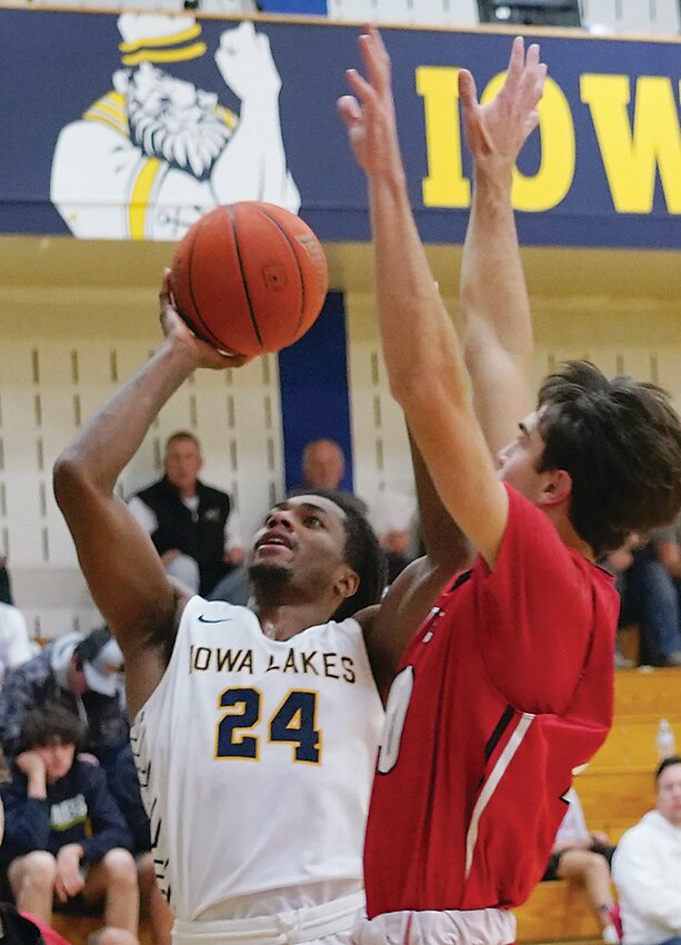 Iowa Lakes Kai Evans (24) goes up for two of his game-high 20 points against the Northwestern Junior Varsity on Monday.