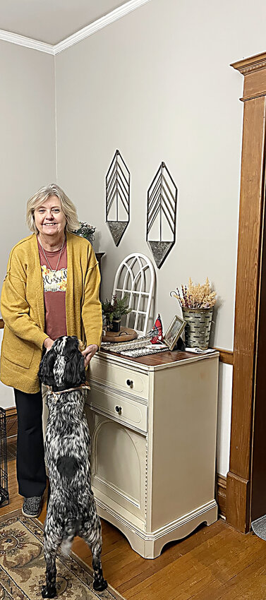Jo Lutz enjoys time at home with her loved ones, including dog Rudy, front.