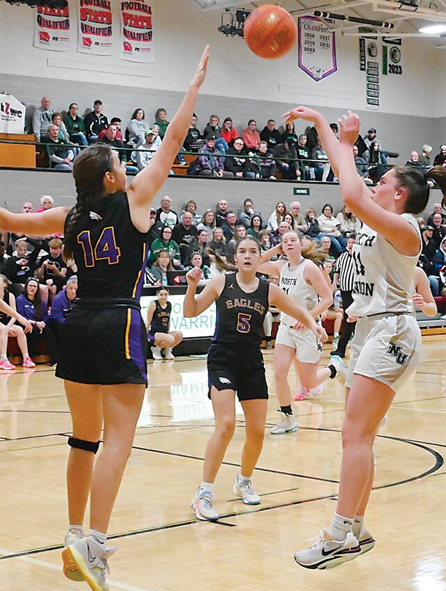 North Union&rsquo;s Ainsley Ulrich shoots over the outstretched hands of the Eagle Grove defender.