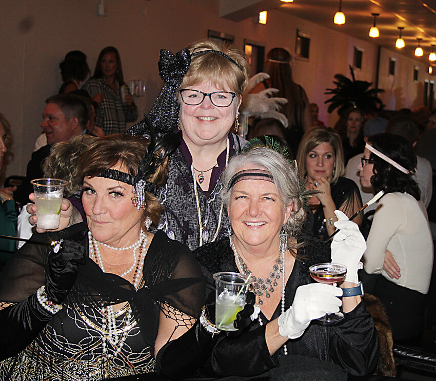 Bernadette Duitsman, left, Lili Jensen, center, and Karla Lester, right, enjoyed the night in Roaring Twenties-style clothing and accessories.
